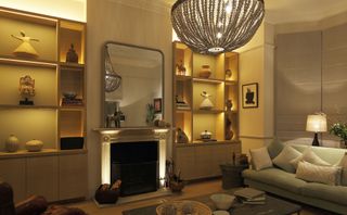 fireplace alcoves used as storage with inset lighting