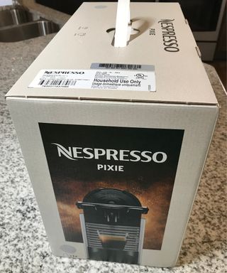 Nespresso Pixie in branded box with plastic handle