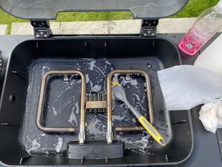 cleaning and scrubbing the Everdure Force 2 barbecue