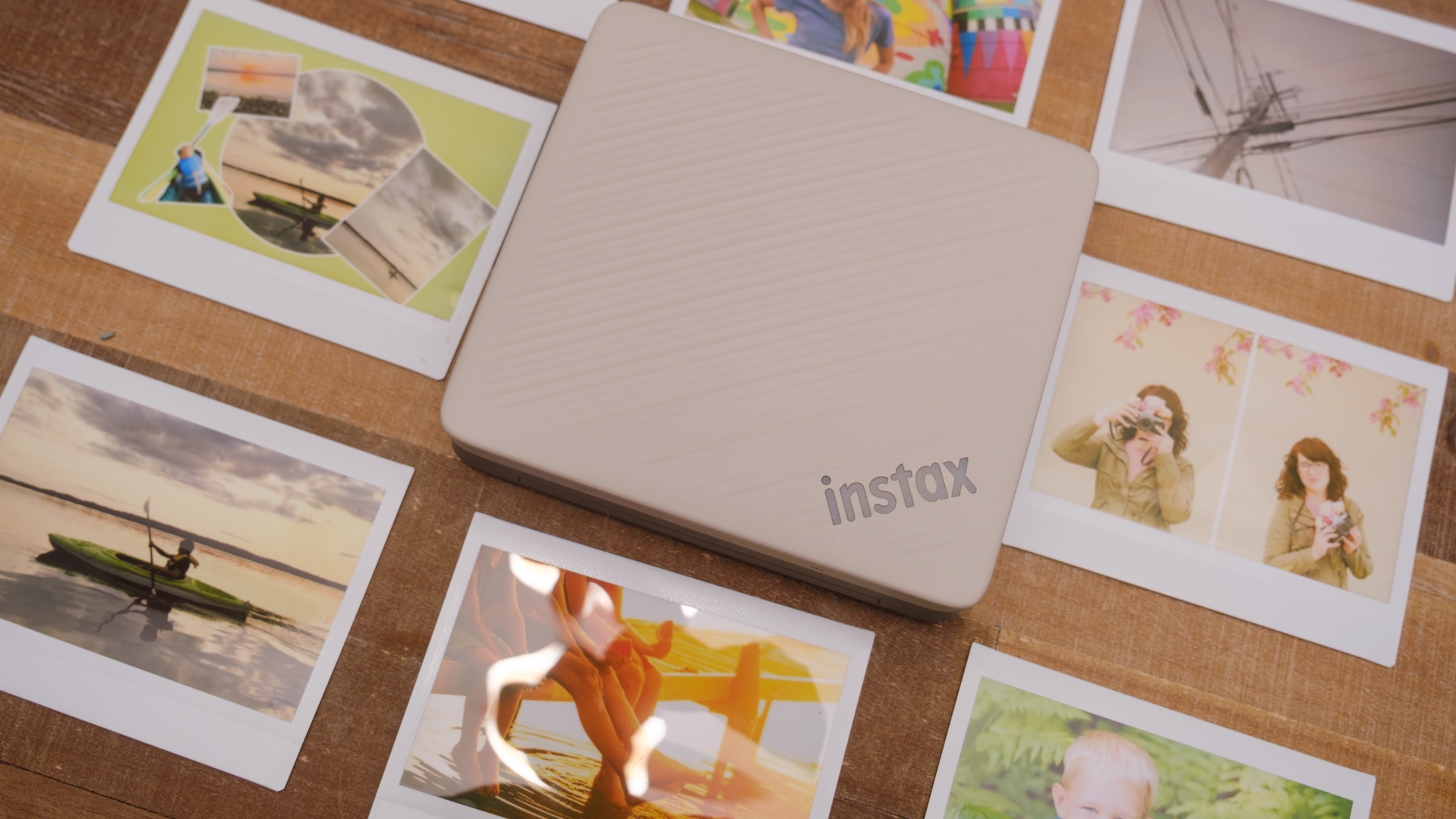 The Fujifilm Instax Link Wide 2 photo printer on a bookshelf