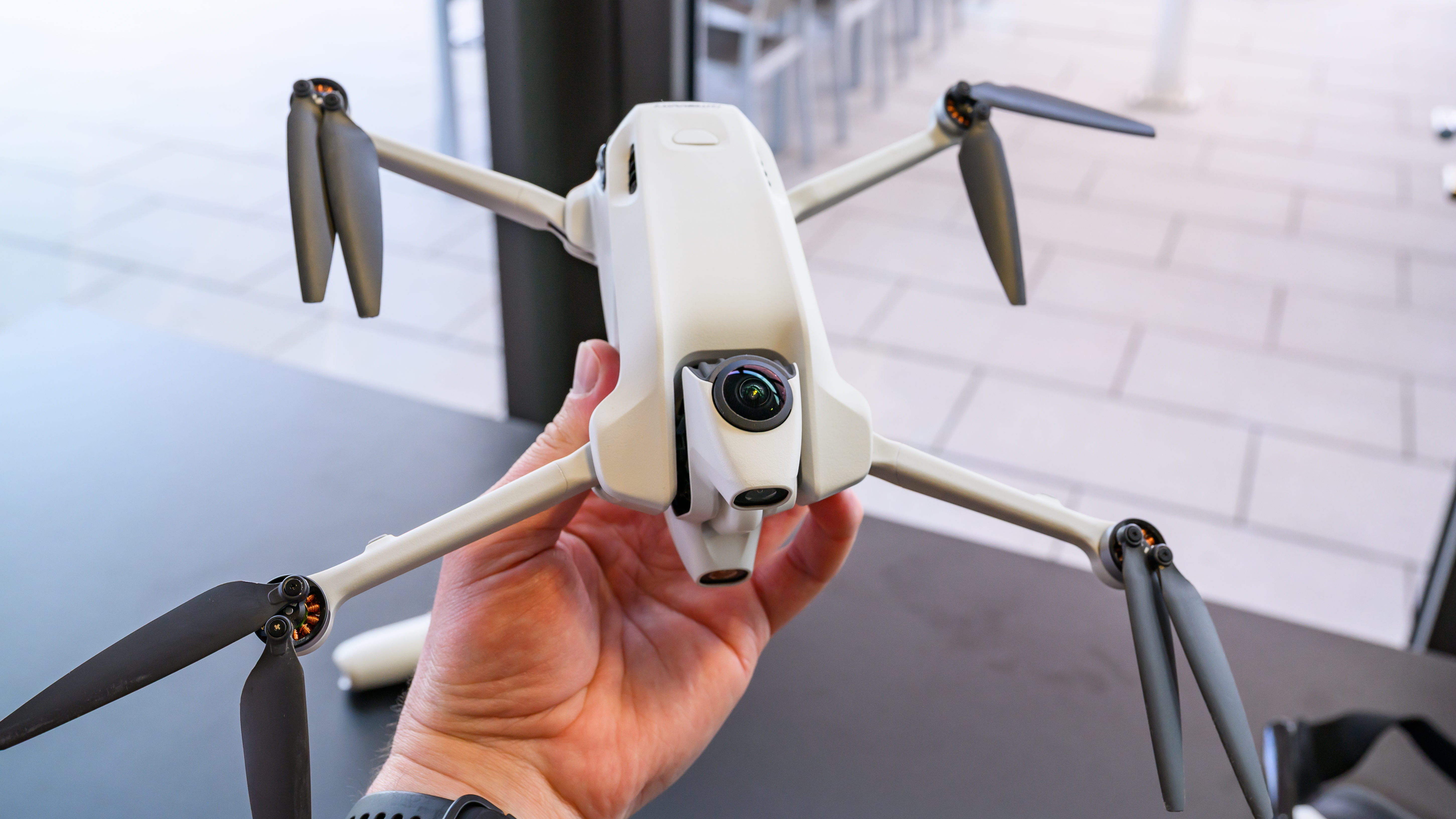 The Antigravity A1 in hand.