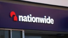 A telephoto shot of the Nationwide sign on the side of a Nationwide building society.
