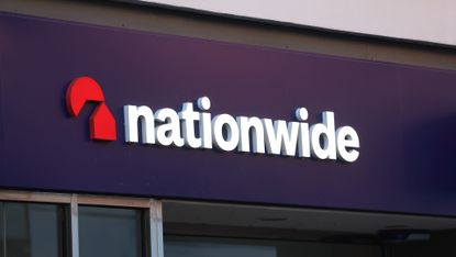 A telephoto shot of the Nationwide sign on the side of a Nationwide building society.