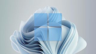 Windows 11 wallpaper superimposed with Windows 11 logo