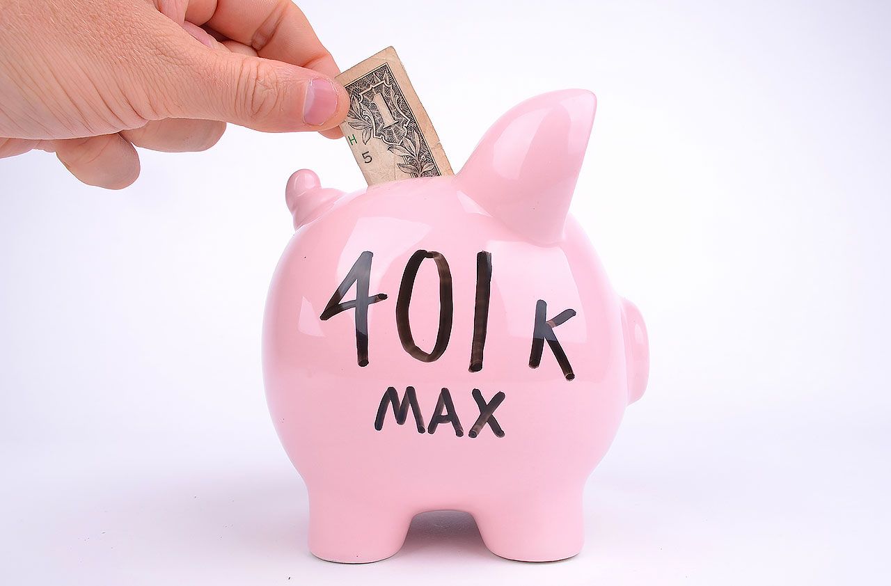 picture of person putting money is a piggy bank with &amp;quot;401k Max&amp;quot; written on it