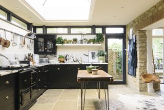 modern shake kitchen in black with marble worktop and splashback