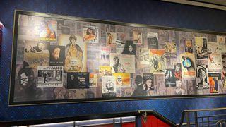 Wall of vintage movie posters inside The Garden Cinema