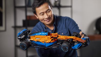 Lego McLaren F1 car held by man