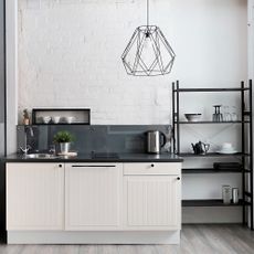 Kitchen with white walls and wooden flooring