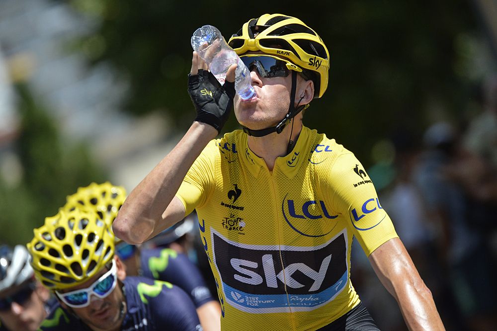 Chris Froome (Team Sky) takes in some water on a hot stage 16