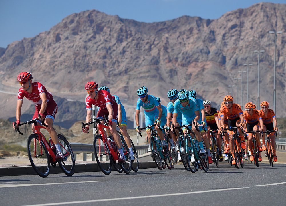 The peloton passes through the outskirts of Muscat during stage two of the 2016 Tour of Oman
