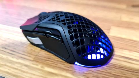 HyperX Aerox 5 gaming mouse with RGB lighting enabled.