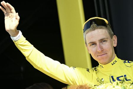 UAE Team Emirates - XRG's Slovenian rider Tadej Pogacar celebrates on the podium with the overall leader's yellow jersey after the 11th stage of the 113th edition of the Tour de France cycling race, 161,3 km between Vichy and Nevers in central France, on July 15, 2026. (Photo by Loic VENANCE / AFP)