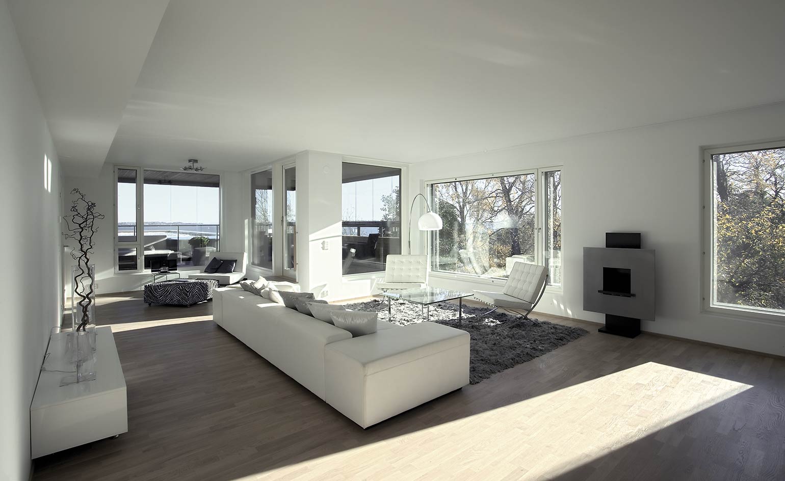 A view of a building inside with sofa and fireplace