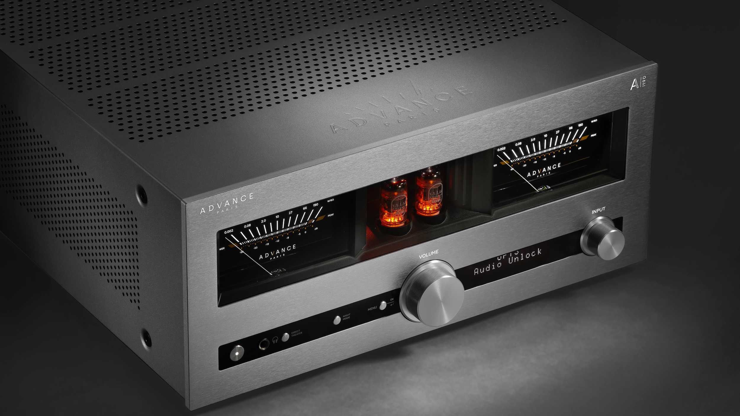 A silver Advance Paris A-i190 amplifier at a 3/4 angle on a dark background.