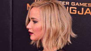 jennifer lawrence on the red carpet with a chopped bob