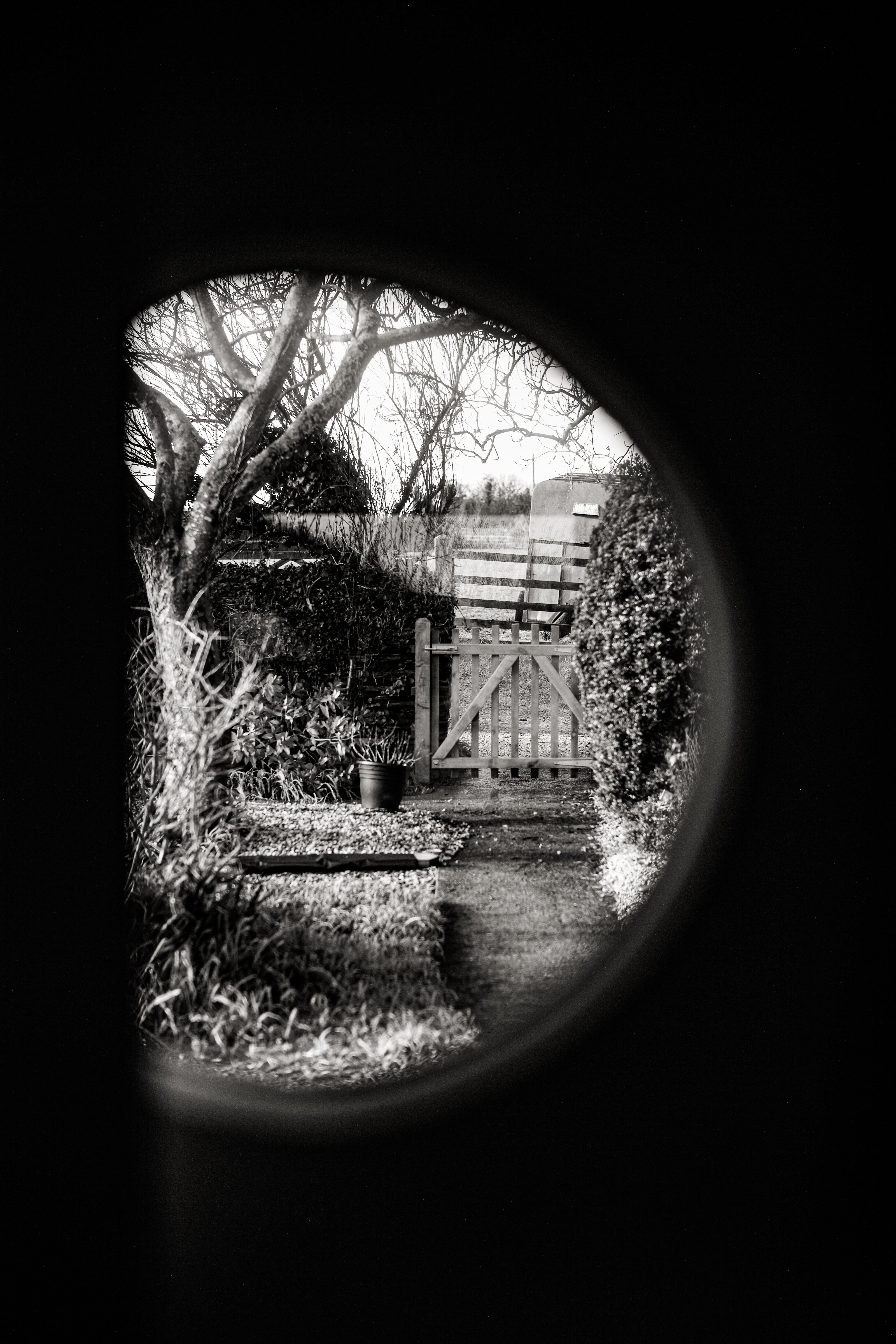 Leica M240 sample image of a porthole revealing a countryside scene