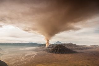 Dense clouds of ash and gasses expelled by the eruption of a volcano — such as Indonesia's Mount Bromo, shown here in 2010 — can affect temperature and weather, sometimes for years.
