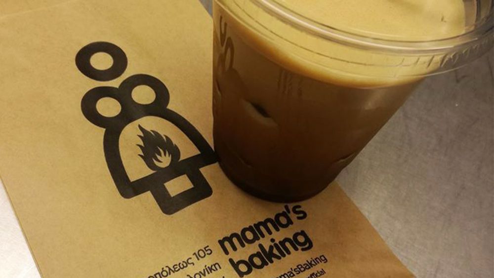 Mama&#039;s Baking logo on a napkin with coffee in a plastic cup