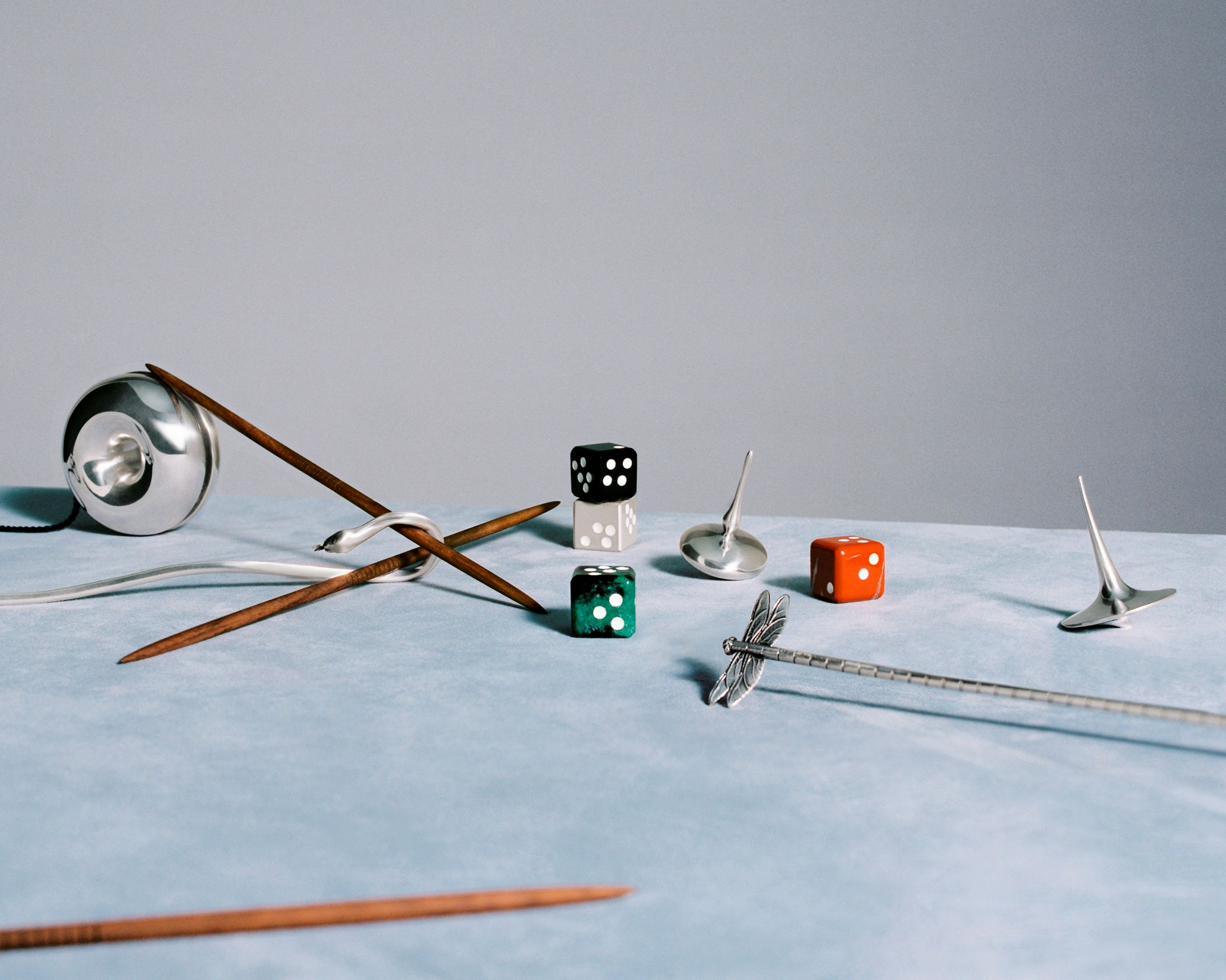 Georg Jensen games including dice, spinning top and Mikado