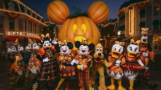 Mickey and Friends in front of the holiday Mickey pumpkin at Disneyland