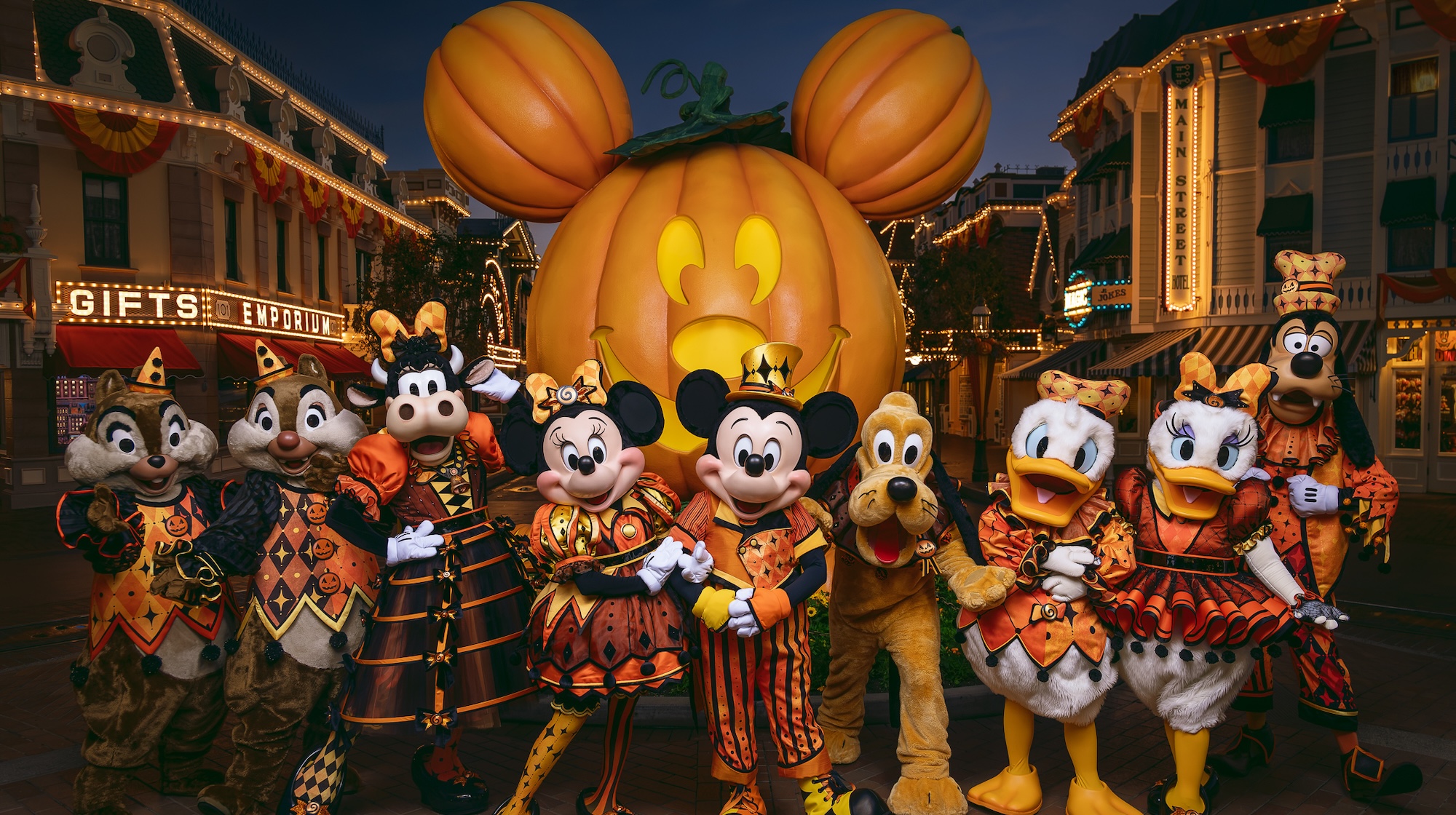 Mickey and Friends in front of the holiday Mickey pumpkin at Disneyland