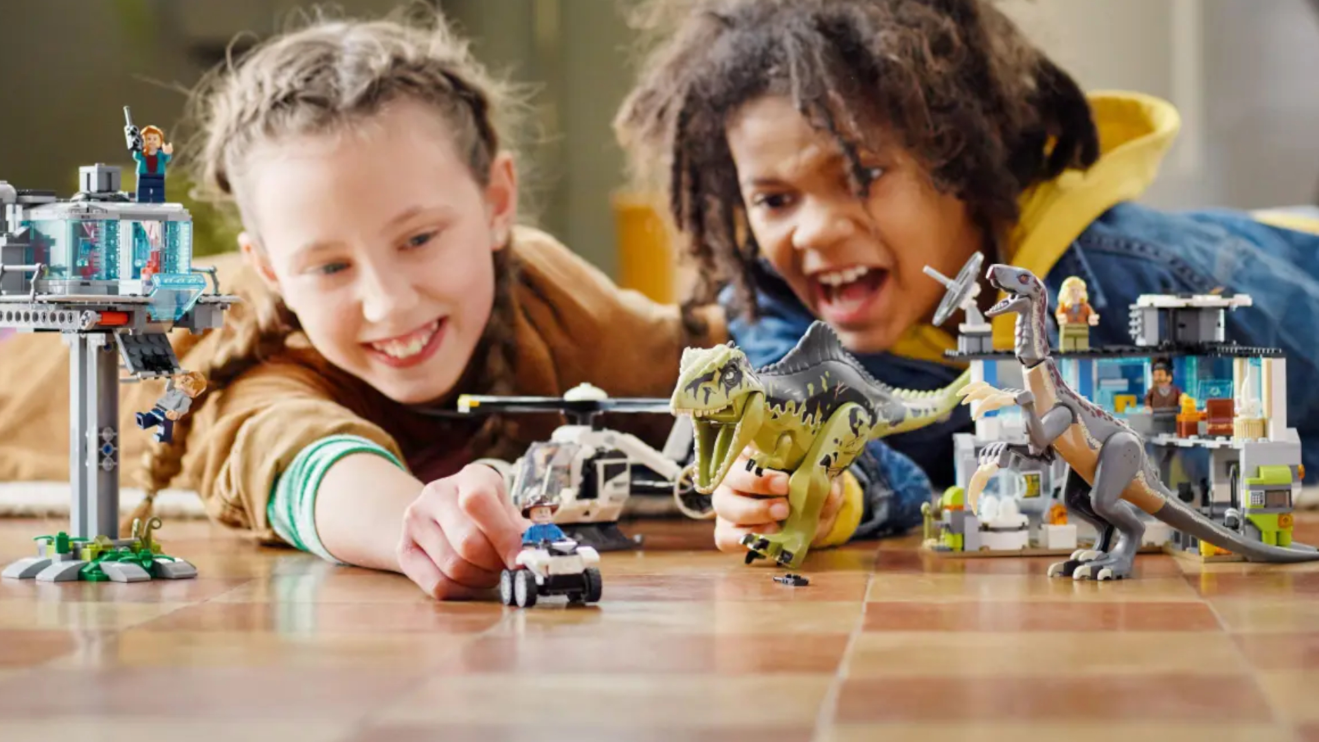 Lego Giganotosaurus & Therizinosaurus Attack set being played with by two children