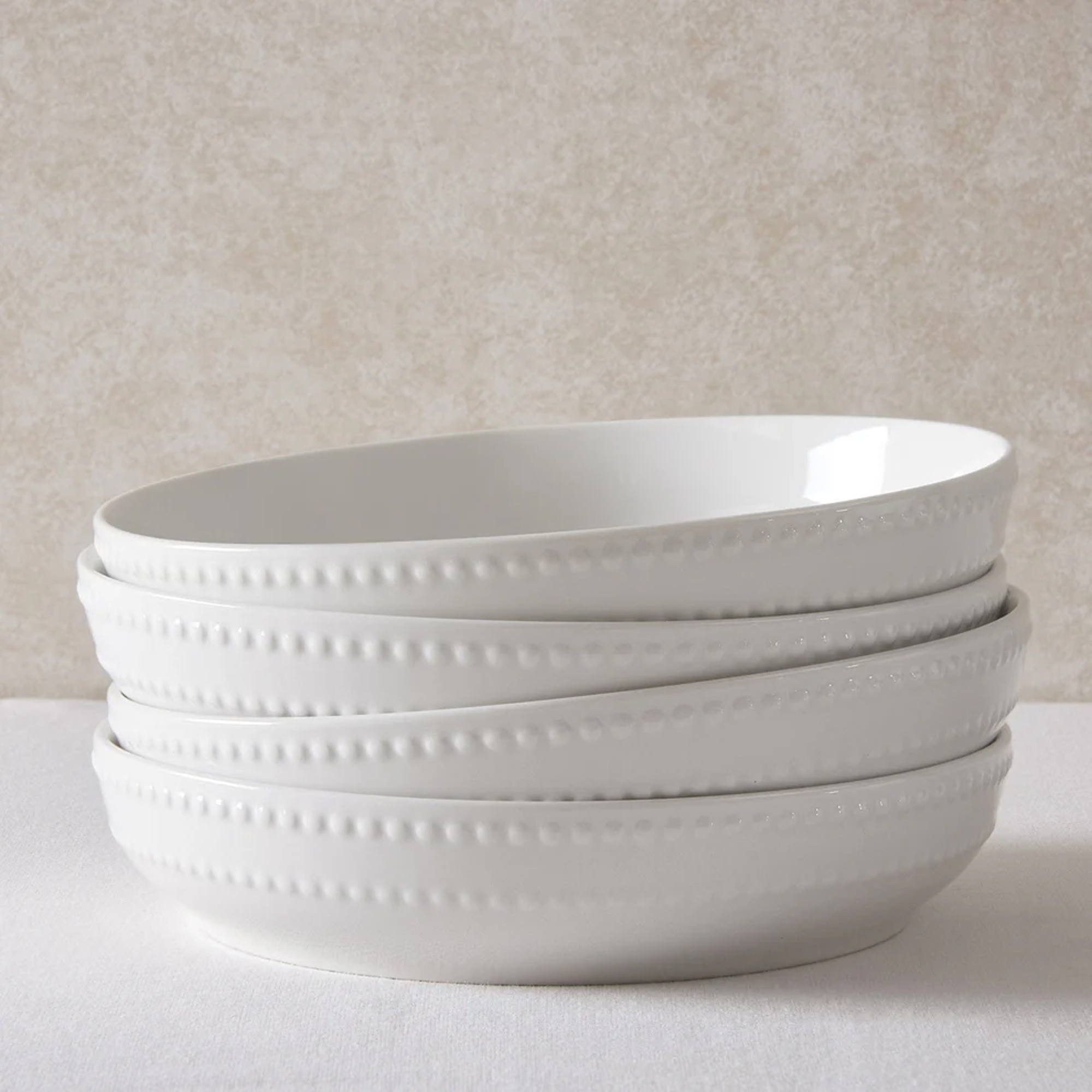 Four DUSK white bowls stacked