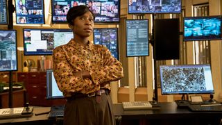 Odette (Cynthia Erivo) in front of several monitors in Luther: The Fallen Sun