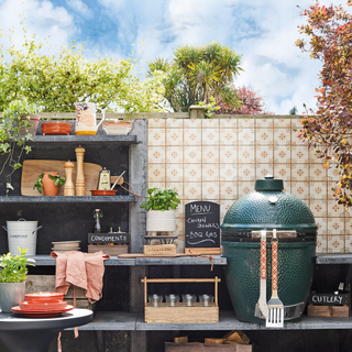 outdoor kitchen with green egg oven and tiles