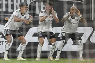 Artuto Vidal (right) celebrates a goal against Sportivo Trinidense in the Copa Libertadores with his Colo-Colo team-mates in March 2024.