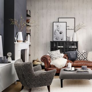 neutral living room with brown leather sofa and cushions