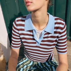 Woman in a striped polo
