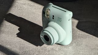 Fujifilm Instax Mini 12 instant camera in green