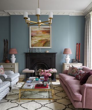 living room with blue walls and pink sofa in Edinburgh Georgian townhouse designed by Jessica Buckley
