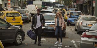 Jovan Adepo and Heather Graham walk the streets of New York In the stand