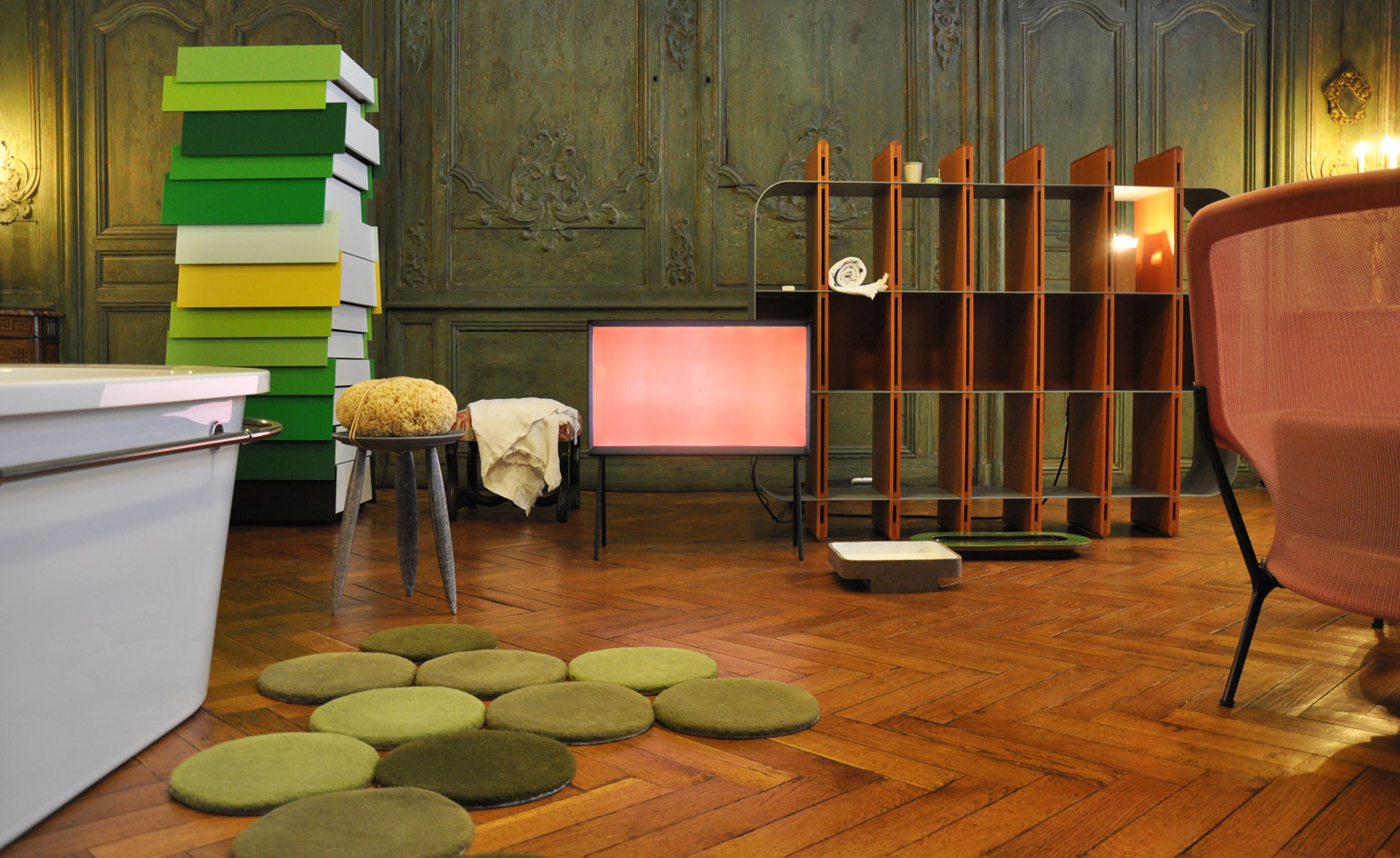 Room with open wooden shelve grey stool with wooden flooring