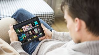 A person watching content on their tablet via Plex