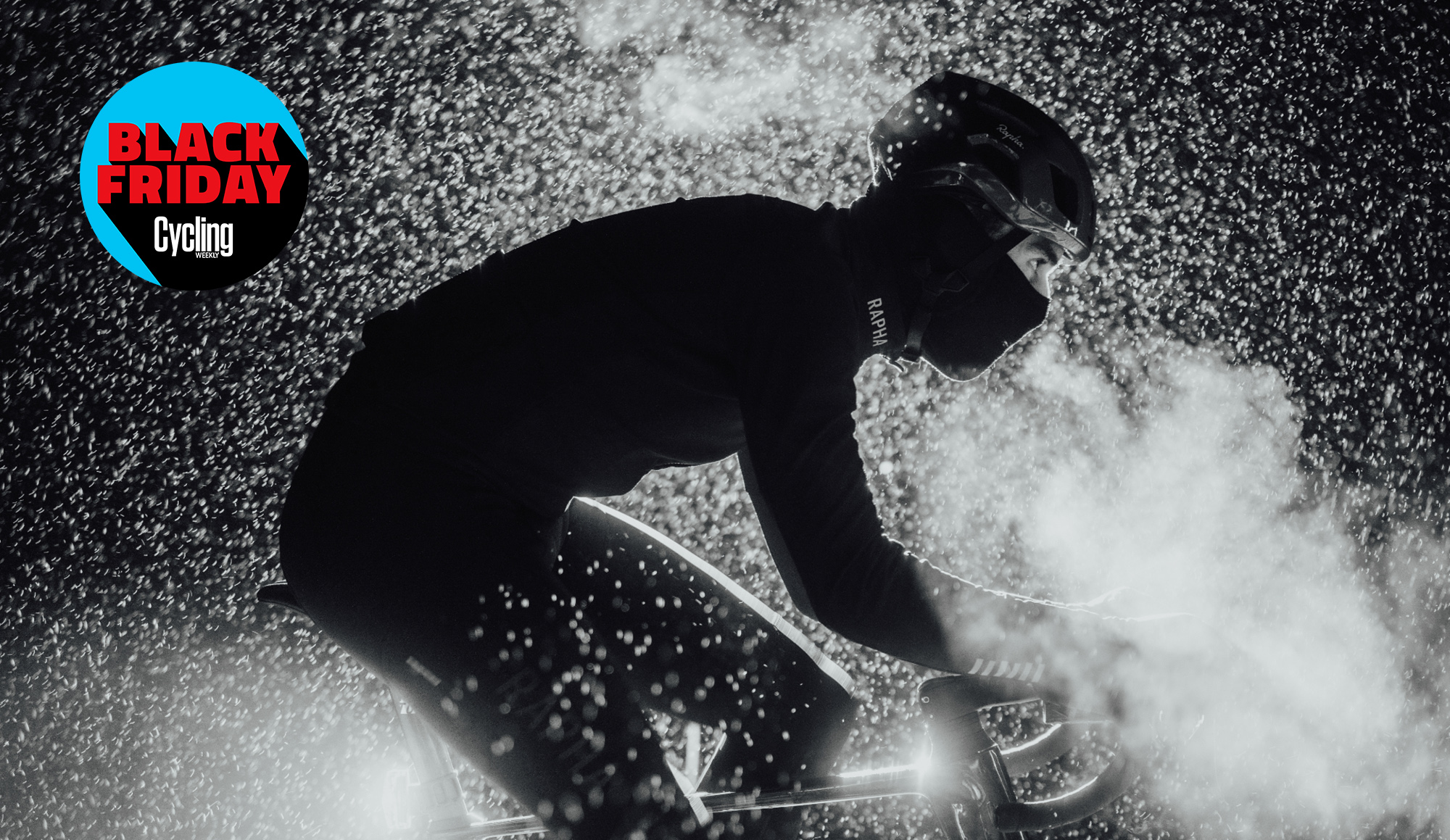 Model in silhouette wearing rapha in the rain