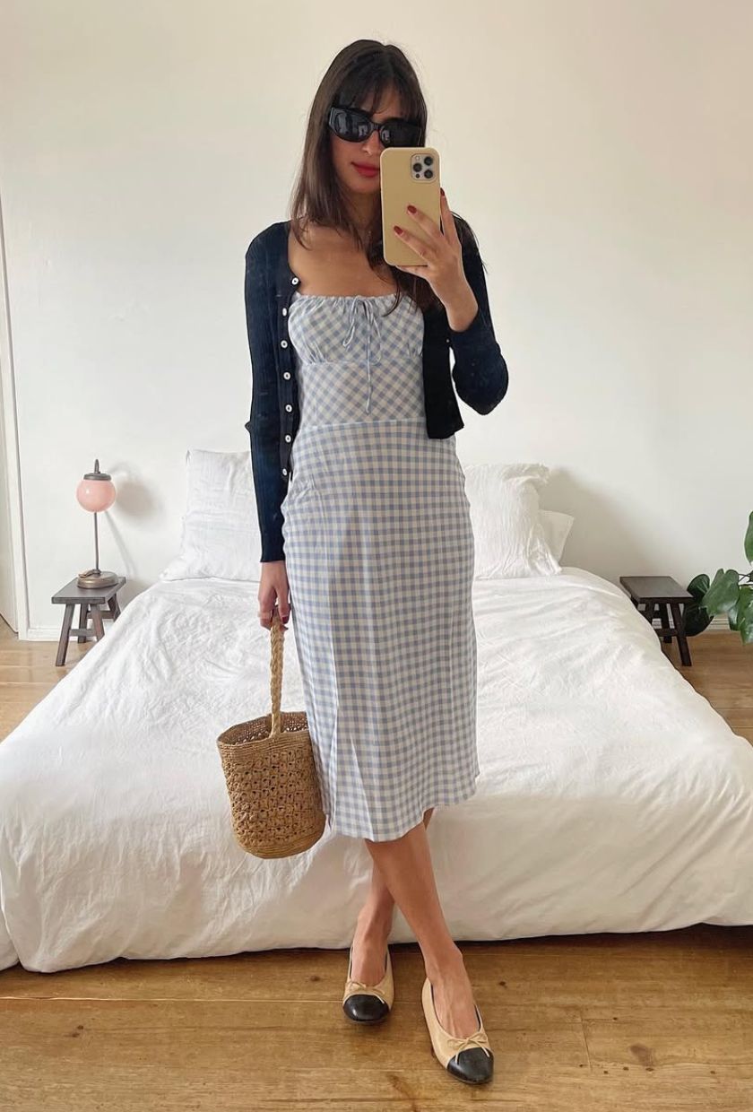 @tamaramory wears a baby blue gingham midi dress with a navy cardigan and two-tone ballet flats