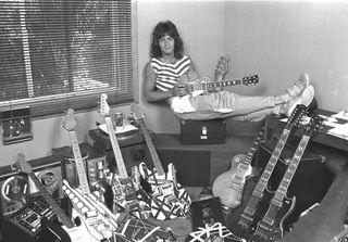 Eddie Van Halen at home in 1980 surrounded by guitars