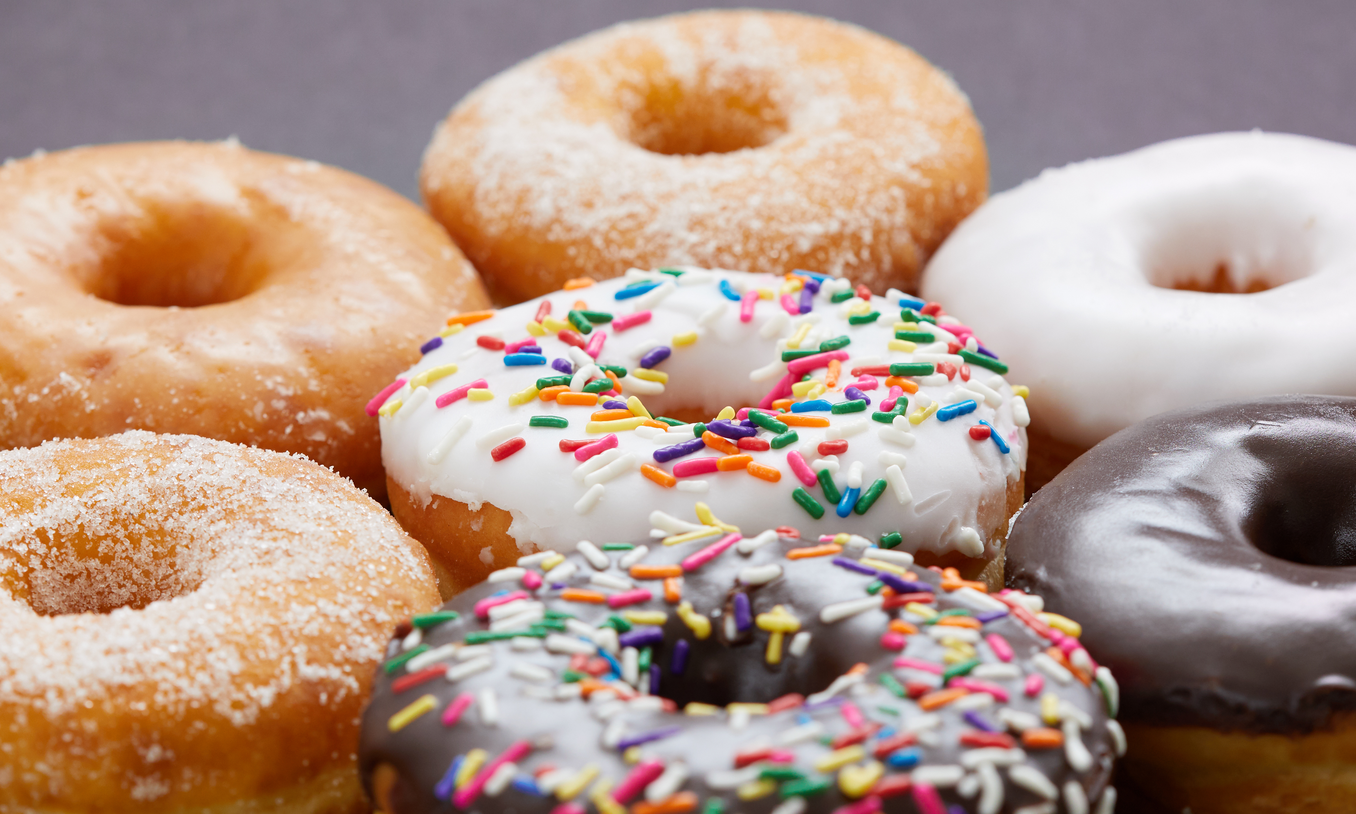 Sugar, chocolate, and sprinkle donuts