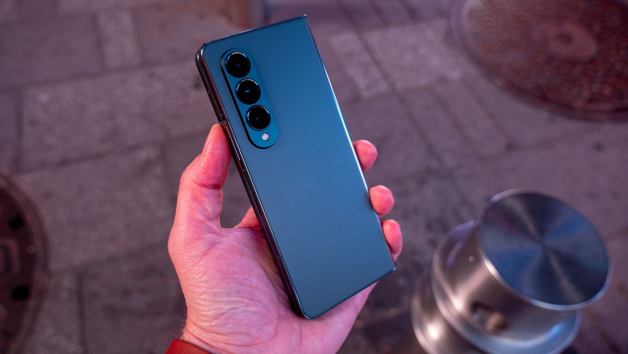 Holding the Samsung Galaxy Z Fold 4 while folded closed