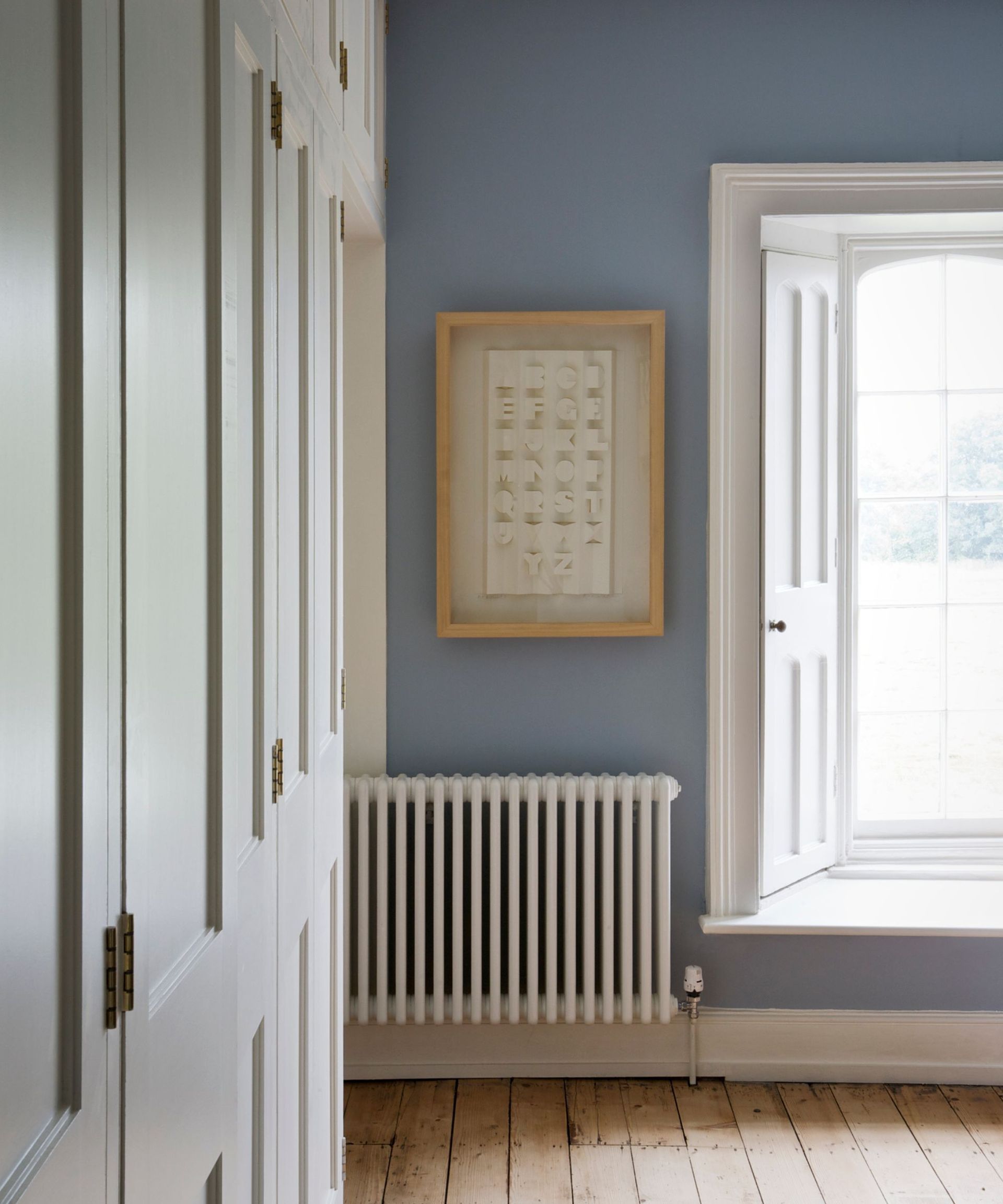 A room painted pale blue and white
