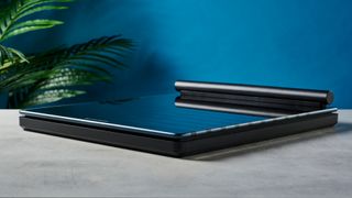 a black tempered glass smart scale with a pull-out ECG monitor showing its sleek modern smart scale finish