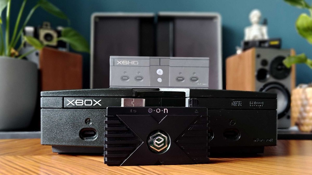 Eon XBHD next to original Xbox on woodgrain table