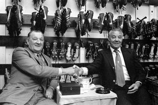 Bob Paisley shakes hands with Joe Fagan as he hands the Liverpool manager's role over to his assistant, 1983