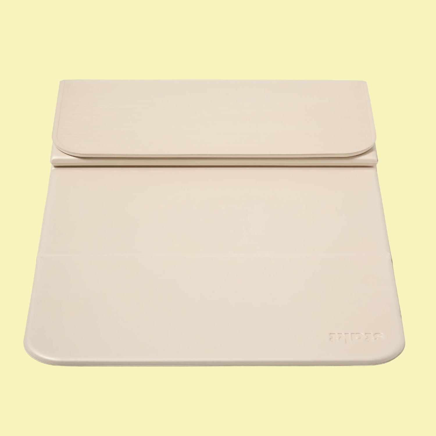 A beige yoga mat