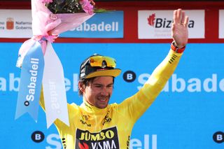 AMURRIO SPAIN APRIL 06 Primoz Roglic of Slovenia and Team Jumbo Visma celebrates winning the yellow leader jersey on the podium ceremony after the 61st Itzulia Basque Country 2022 Stage 3 a 1817km stage from Llodio to Amurrio itzulia WorldTour on April 06 2022 in Amurrio Spain Photo by Gonzalo Arroyo MorenoGetty Images