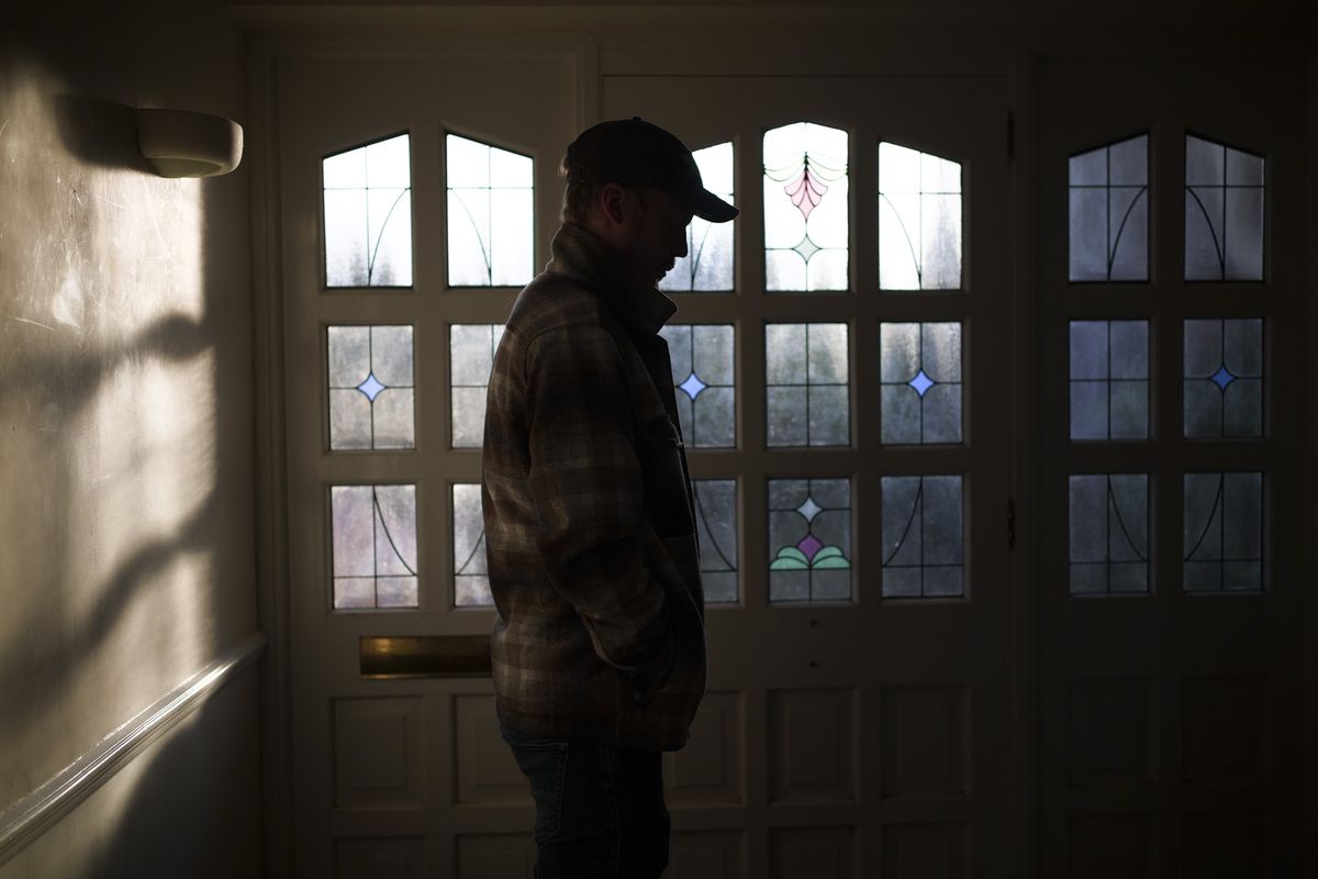 Silhouette of person standing in front of a glass door, taken with the Sigma BF camera and Sigma 35mm F2 DG lens